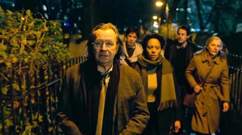 A still from Apple TV’s adaptation of Mick Herron’s Slow Horses, with Gary Oldman in foreground playing Jackson Lamb. 