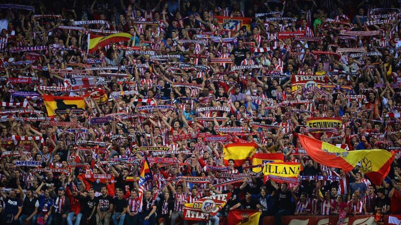 The Atletico Madrid fans show their colours during the match. Photograph: Laurence Griffiths/Getty Images