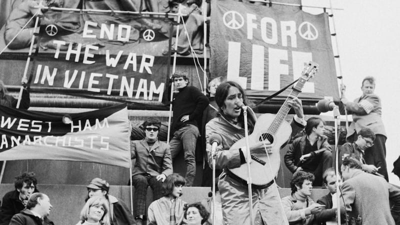 Joan Baez performs at an anti-Vietnam War demonstration in London, 1965. Photograph: Keystone/Hulton Archive/Getty Images