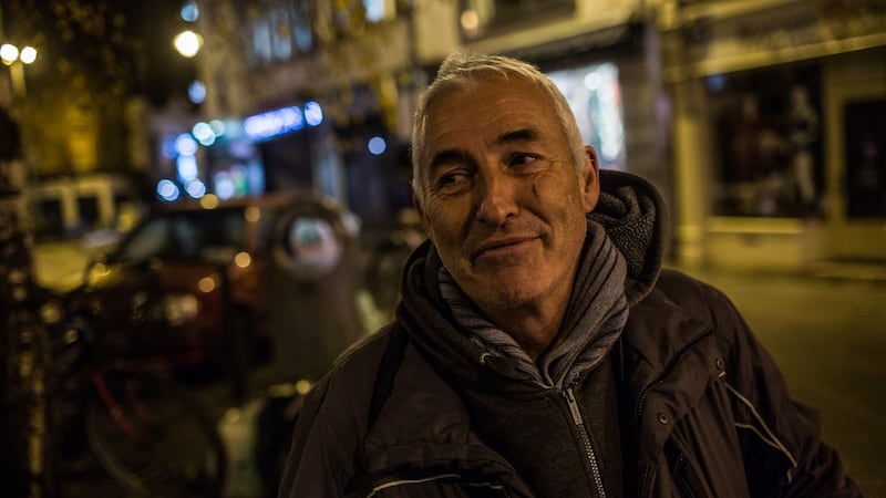 Raymond Mahady, who is homeless, chats to volunteers from the Simon community near St Stephen’s Green in Dublin. Photograph: James Forde