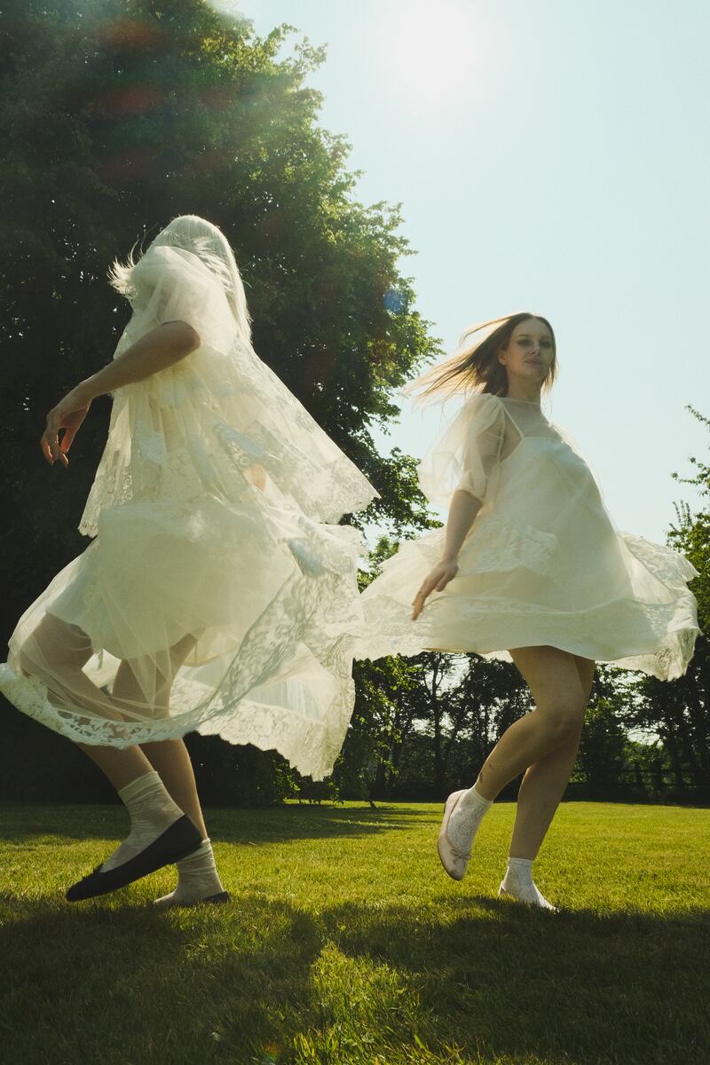 Isabele blouse in ivory/cream €600, Alice skirt €520, Rose dress in ivory/cream €600.