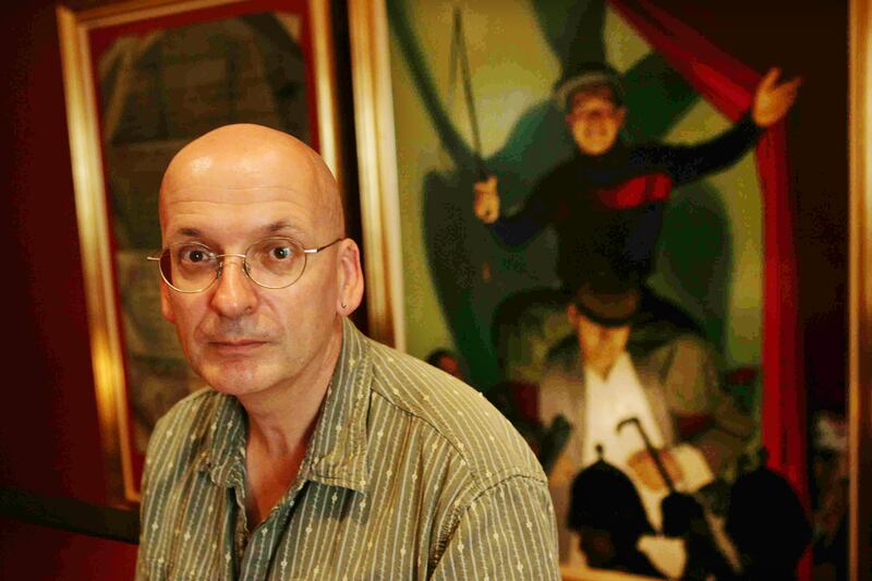 Roddy Doyle in front of a scene from The Playboy of the Western World at the Abbey Theatre, 2007. Photograph: Cyril Byrne 