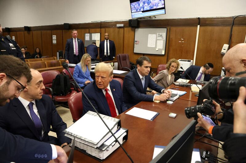 Donald Trump settling in the courtroom ahead of his criminal trial at Manhattan Criminal Court. Photograph: Jefferson Siegel/New York Times
                      