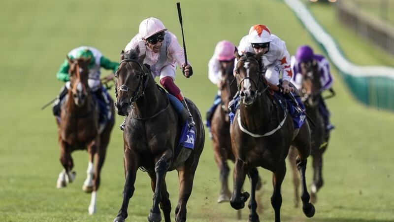 Frankie Dettori riding Too Darn Hot celebrates early as they win The Darley Dewhurst Stakes at Newmarket. Photograph: Alan Crowhurst/Getty Images