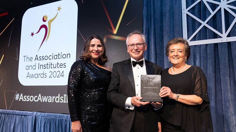 William Donnelly, awards judge, presents the best association of the year awards to Gillian Walker and Marie Ó Mír, Irish Society of Chartered Physiotherapists