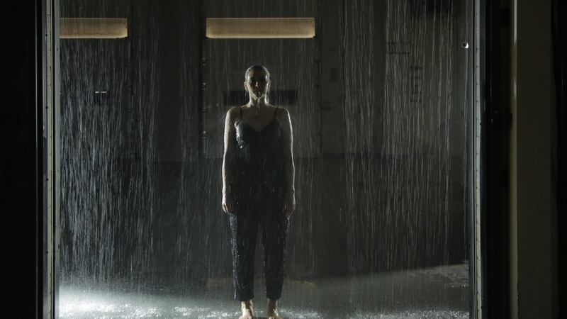 Dancer Sibhéal Davitt moves through a wall of water as part of the Woman in the Machine art event in the former Braun site in Carlow.