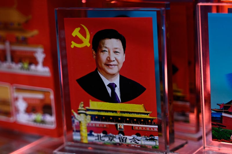 A portrait of Chinese president Xi Jinping at a souvenir shop in Beijing. Photograph: Pedro Pardo/Getty 