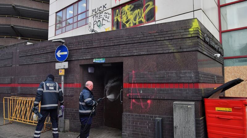 Workers from the Bristol Business Improvement District clean graffiti outside Bridewell Police Station. Photograph: Ben Birchall/PA Wire