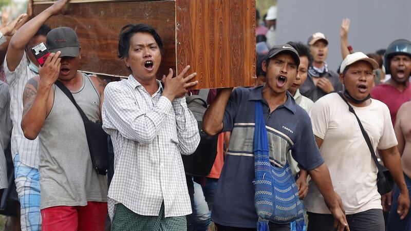 Mourners carry the coffin on Saturday of Tin Hla (43), who was shot dead by security forces during a protest against the military coup, in Thanlyin township, on the outskirts of Yangon. Photograph: Myat Thu Kyaw/NurPhoto via Getty Images