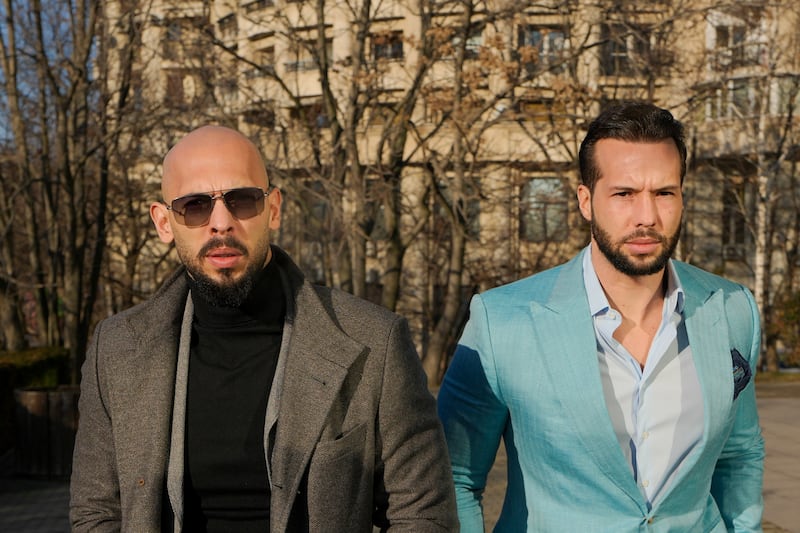 Andrew Tate, left, and his brother Tristan arrive at the Bucharest Tribunal in Bucharest, Romania(AP/Vadim Ghirda)