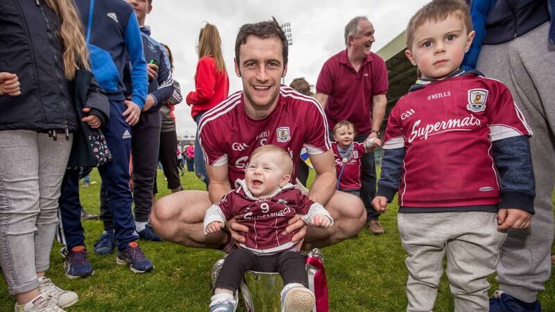 David Burke, then Galway captain, celebrates with the Division One trophy after the 2017 final against Tipperary, with his neice and nephew. Photograph: Inpho