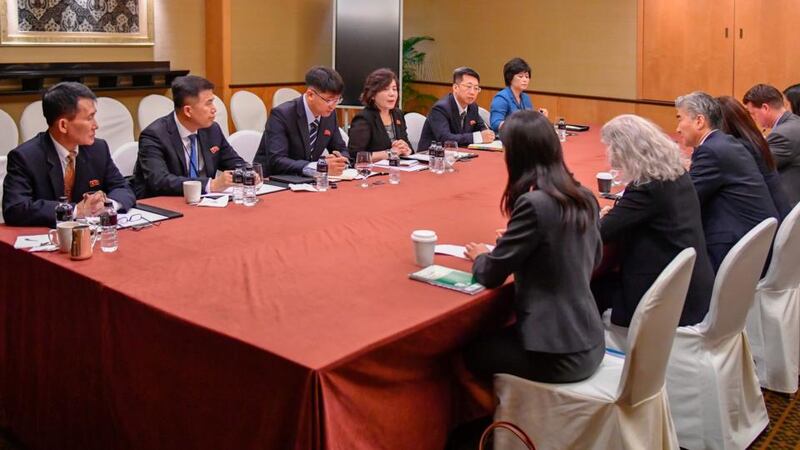 In this photo released by the US State Department, members of the North Korean delegation (left), meet with members of the US delegation during a working group meeting on Monday in Singapore, a  day before President Donald Trump will meet North Korean leader Kim Jong-un. Photograph: US State Department/AP