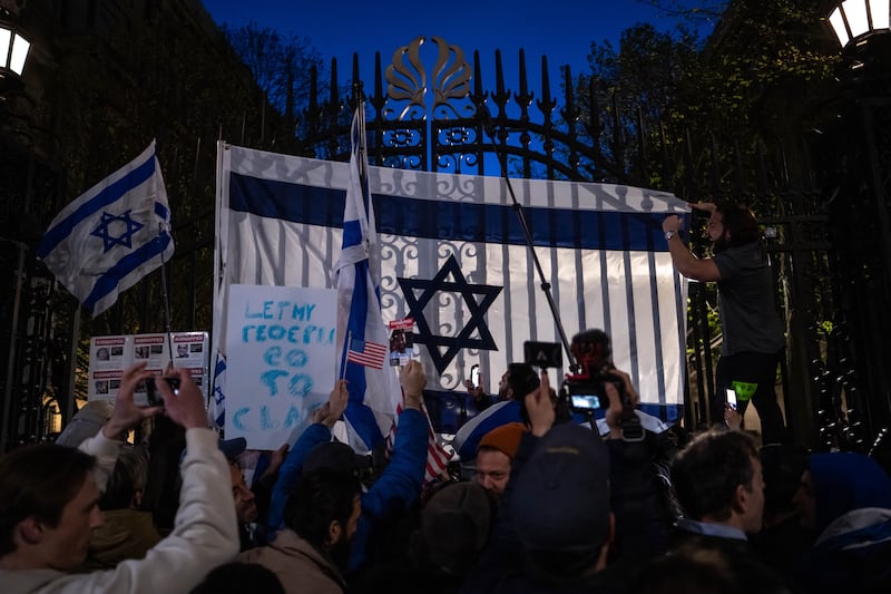 People demonstrate in support of Israel at the gates of Columbia University on Thursday night. Photograph: Adam Gray/New York Times 