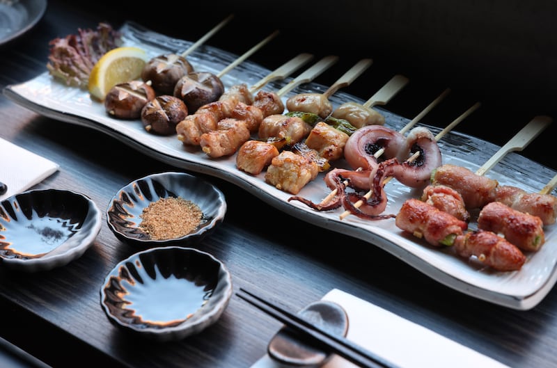 Shiitake skewers, pork belly skewers, Negima yakitori, octopus skewers and asparagus bacon skewers at Hana Izakaya