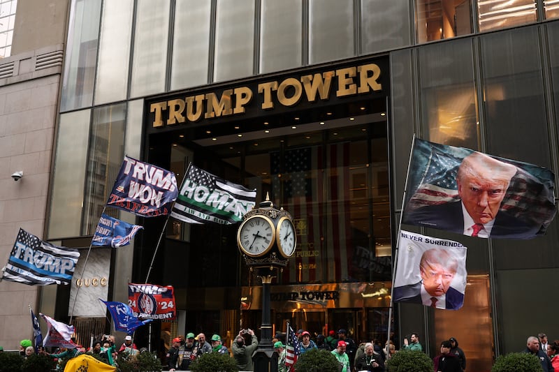 Supporters of US president Donald Trump gather outside Trump Tower holding flags during the annual St Patrick's Day Parade in New York City. Photograph: Charly Triballeau/AFP via Getty Images    