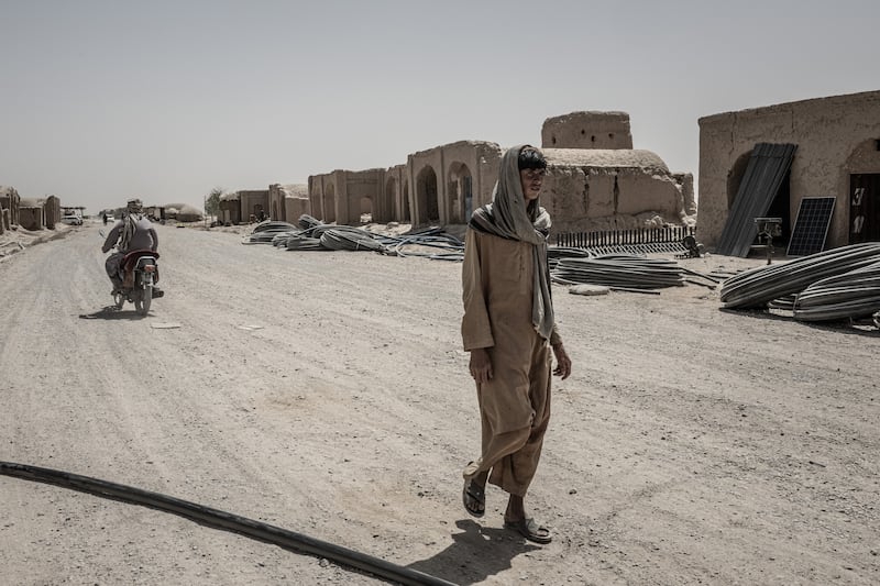 Surplus water pipes line the road of a quiet bazaar in southwest Afghanistan’s arid Bakwa district, once a hub of the narcotics trade, on August 17th, 2023. The same Taliban who embraced opium to help finance their war have now all but cleared Afghanistan of poppy and other illicit drugs. But in Bakwa, the depleted aquifer had already cost farmers dearly. Photograph: Bryan Denton/The New York Times