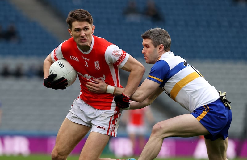 Cuala's Michael Fitzsimons and Thomas Canavan of Errigal Ciaran. Photograph: Bryan Keane/Inpho