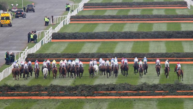 Runners and riders clear the first in  the Grand National at Aintree.  Photo: Pete Byrne/PA Wire