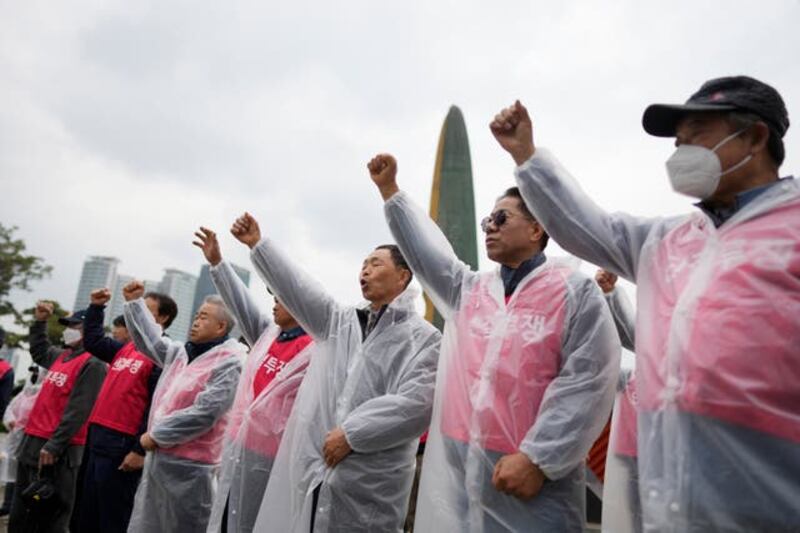 Dog farmers shout slogans during a rally in Seoul, South Korea. Photograph: Lee Jin-man/AP