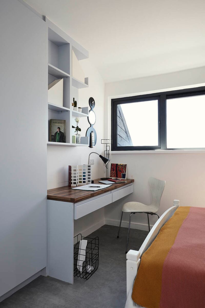 After shot of bedroom with home office and open shelving. Photograph: Philip Lauterbach