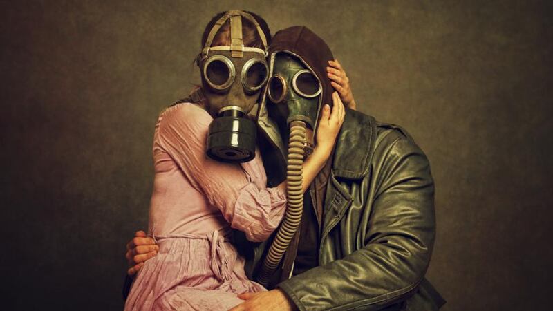 Mixed-up metaphors: a couple in gas masks, bizarrely meant to denote everlasting love. Photograph: Getty