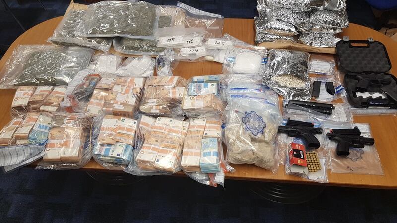 Three firearms and drugs valued at approximately €958,000 were found as well as €489,120 in cash.