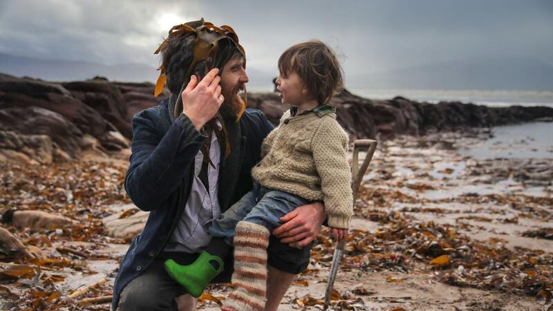 Diarmuid Lyng collects kelp and dillisk seaweed with his son Uisne on the beach at Bunaneer on the Dingle Peninsula. Photograph: : Valerie O’Sullivan