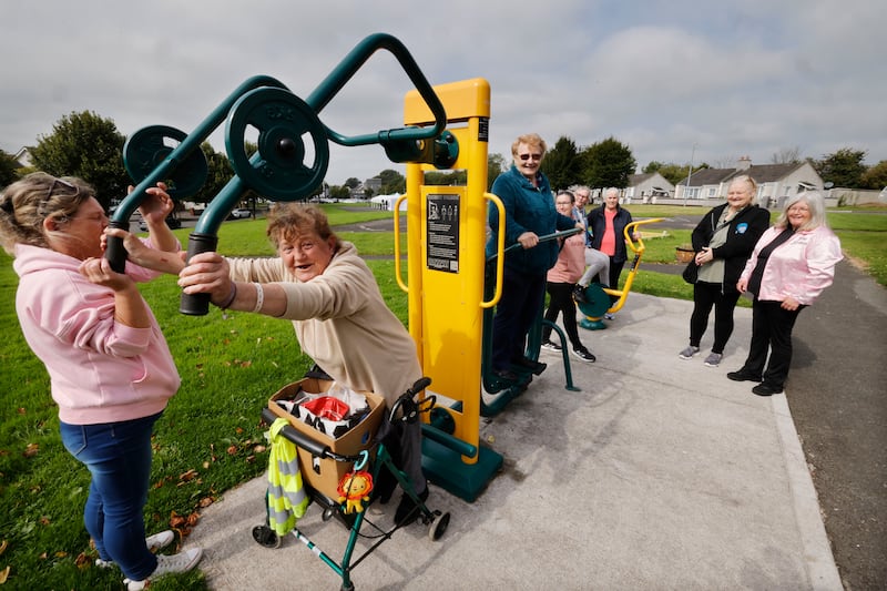 Local residents Mary Hayes (left) helping  Ann Kelly try out the estates outdoor exercise equipment along with other residents and members of Sallins Womens Shed at the official launch of Ireland’s First Age Friendly Housing estate, Castlefen, at Sallins in Co. Kildare.
Photograph: Alan Betson / The Irish Times

