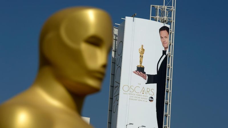 A poster showing actor Neil Patrick Harris holding an Oscar statue is seen on Hollywood Boulevard ahead of 87th Annual Academy Awards at Dolby Theater. Photograph: Kevork Djansezian/Getty Images