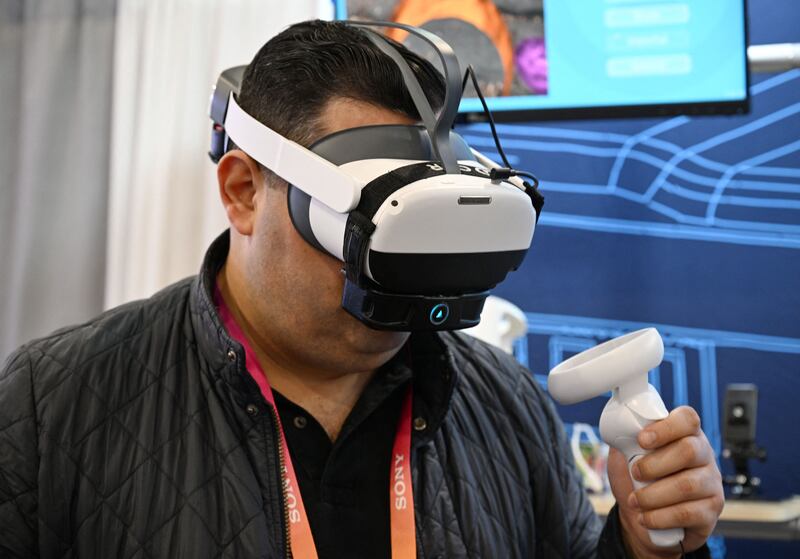 An attendee tries OVR Technology's ION 3, a wearable scent technology, at CES. Photograph: Robyn Beck/AFP via Getty