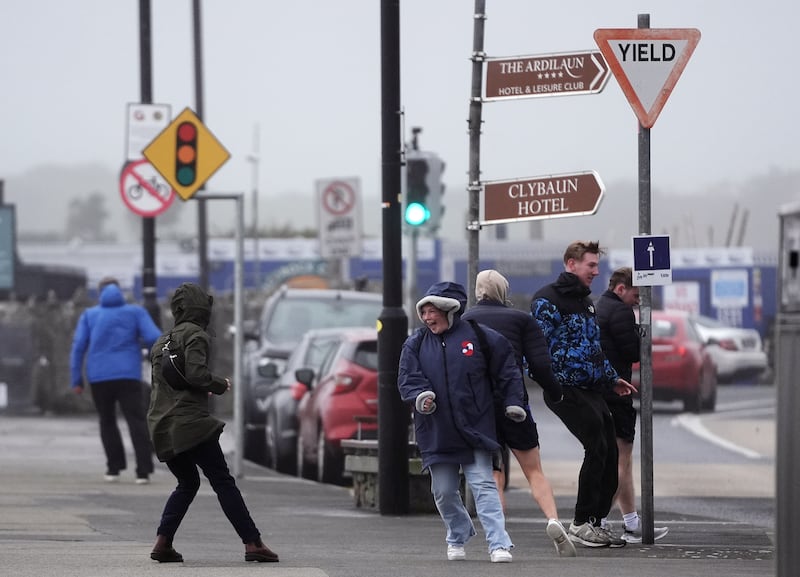 People struggle to walk in the wind on the promenade in Salthill. Photograph: Brian Lawless/PA