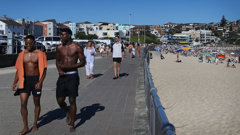 Beachgoers enjoy warm weather on Australia Day at Bondi Beach, Sydney,  on January 26th. Foreign tourists will be welcomed back next week for the first time since the pandemic began. Photograph:  Lisa Maree Williams/Getty Images