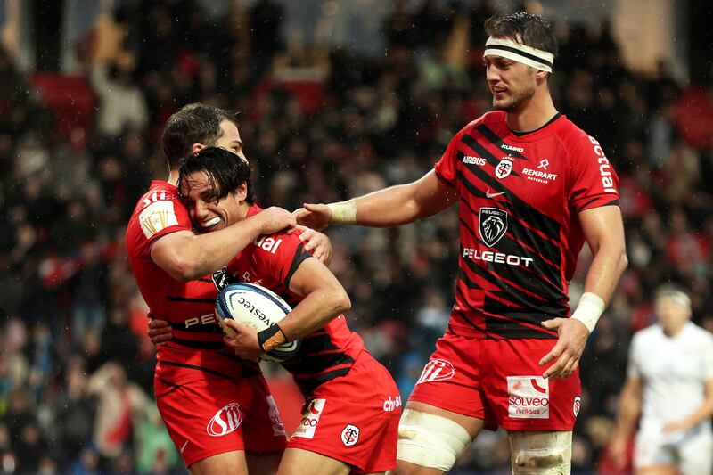 Stade Toulousain's Ange Capuozzo celebrates scoring a try with Antoine Dupont and Alexandre Roumat. Photograph: Laszlo Geczo/Inpho