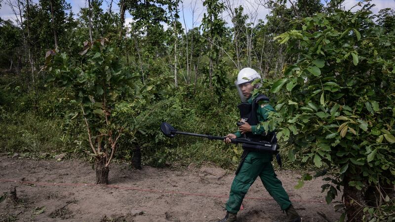 A deminer with the Mines Advisory Group worked in a minefiled in Battambang province in November 2016. Cambodia remains one of the most mine- and UXO-contaminated countries in the world. Photograph: Lauren Crothers