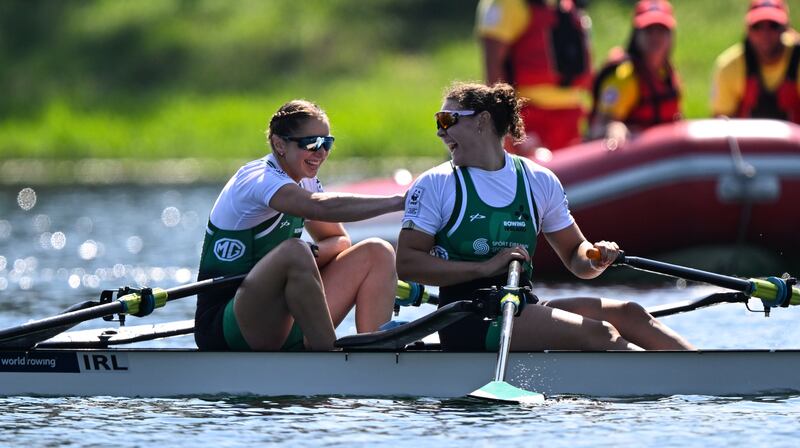 Ireland’s Alison Bergin and Zoe Hyde celebrate their fourth-place finish at the World Championships which qualified the boat for Paris. Photograph: Detley Seyb/Inpho 