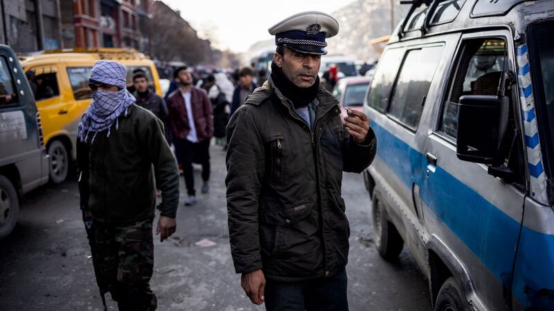 A traffic police officer in Kabul. Photograph: Jim Huylebroek/The New York Times