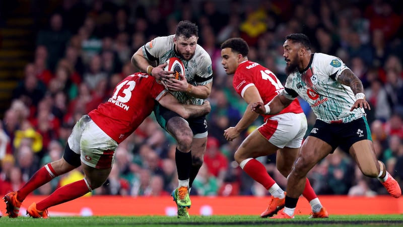 Robbie Henshaw tries to burst past Max Llewellyn and Ben Thomas during Ireland's win in Wales. Photograph: Ben Brady/Inpho