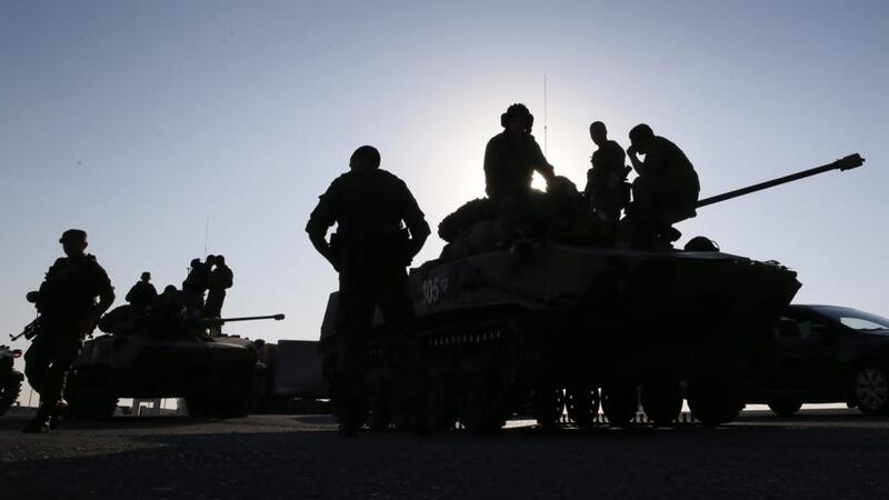 Aid mission?: Russian armoured vehicles assembled near the convoy. Photograph: Yuro Kochetkov/EPA