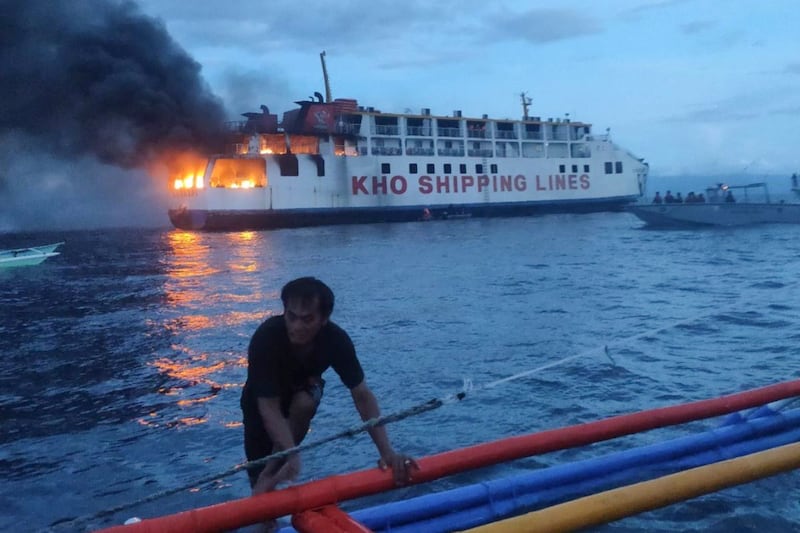 Photos and video released by the coast guard showed flames and black smoke billowing from two decks at one end of the ferry. Photograph: Philippine Coast Guard via AP