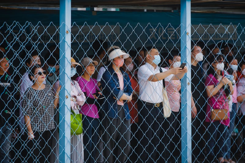 Parents and relatives wait for students outside a school on the first day of China's annual National College Entrance Examination in Beijing. Photograph: Wu Hao/EPA-EFE