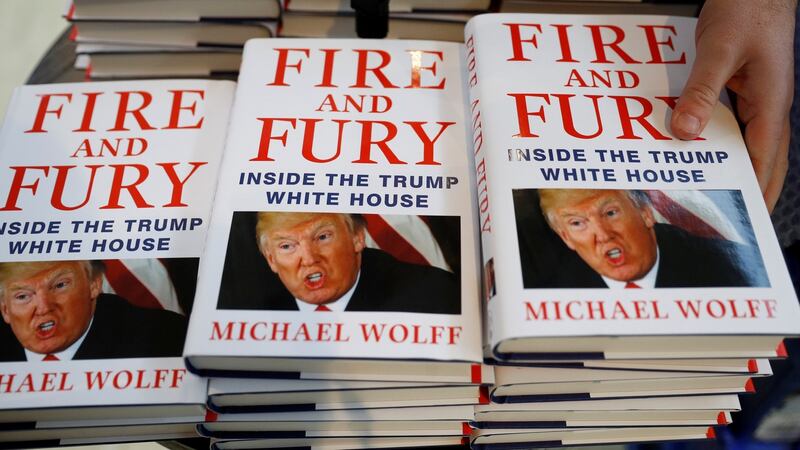 A shop worker arranges copies of Michael Wolff’s book Fire And Fury as they go on sale inside a branch of the Waterstones book store in Liverpool on January 11th. Photograph: Phil Noble/Reuters