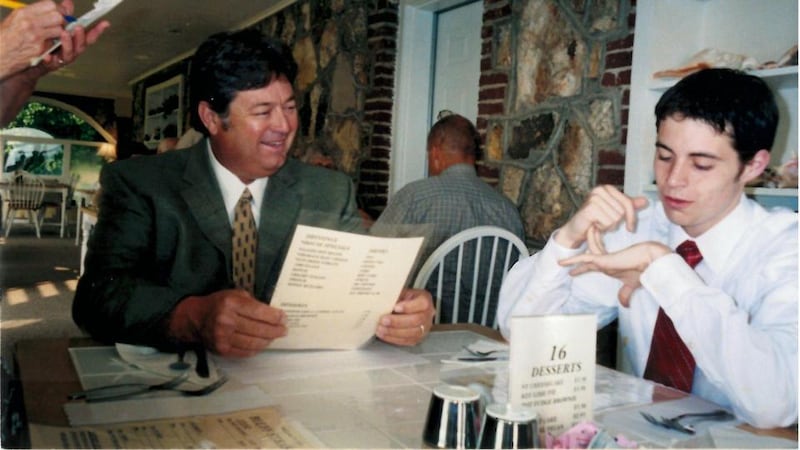 Garrad Conley and his father at graduation dinner in 2003.