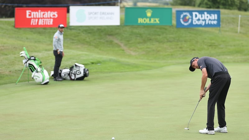 Dale Whitnell putts out on the 18th green. Photo: Warren Little/Getty Images