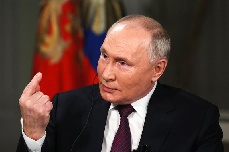  Russian president Vladimir Putin gestures while speaking to Tucker Carlson at the Kremlin. Photograph: Gavriil Grigorov/Sputnik/Kremlin Pool Photo/AP