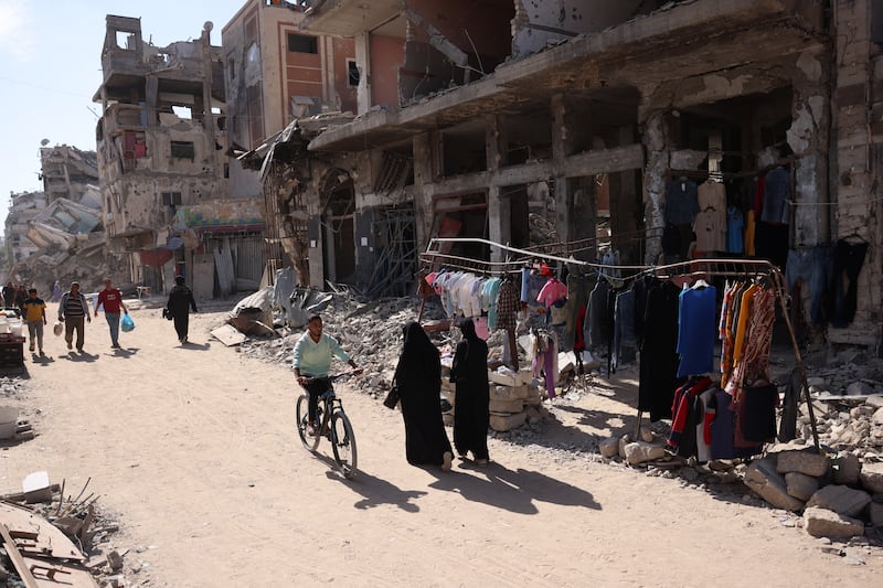 Palestinians walk past a damaged building in Khan Yunis in the southern Gaza Strip on October 29th. Photograph: Bashar Taleb/AFP via Getty