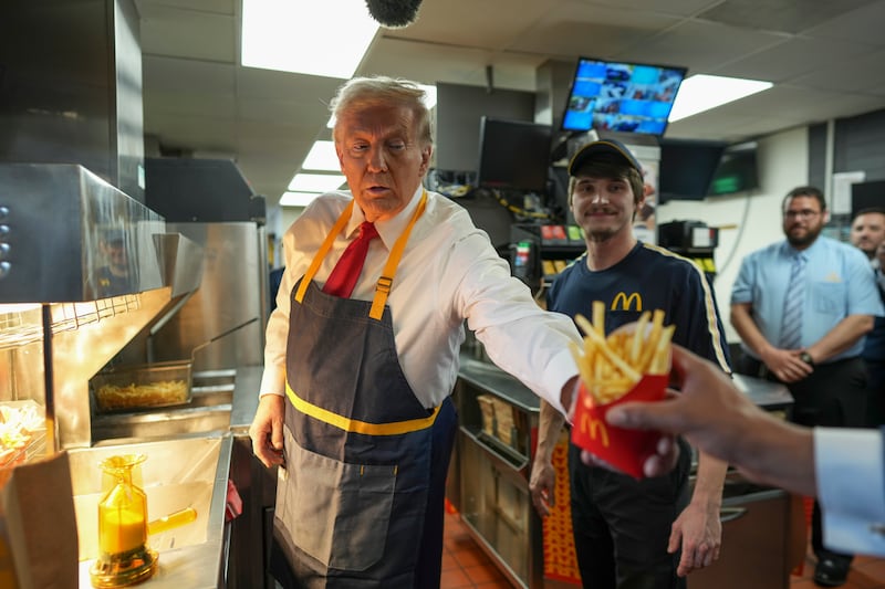 Donald Trump serves fries during a visit to a McDonald's in Feasterville-Trevose, Pennsylvania. Photograph: Doug Mills/The New York Times
                      