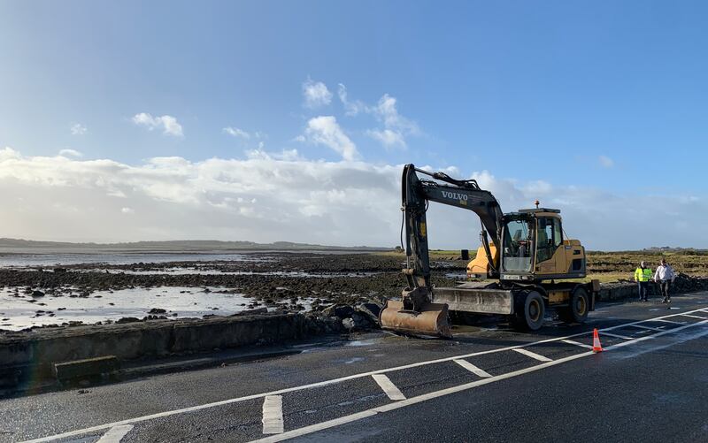 Local authority response teams clear the sea wall off the Coast Road outside Oranmore, Co Galway after Storm Debi. Photograph: Ed Carty/PA Wire