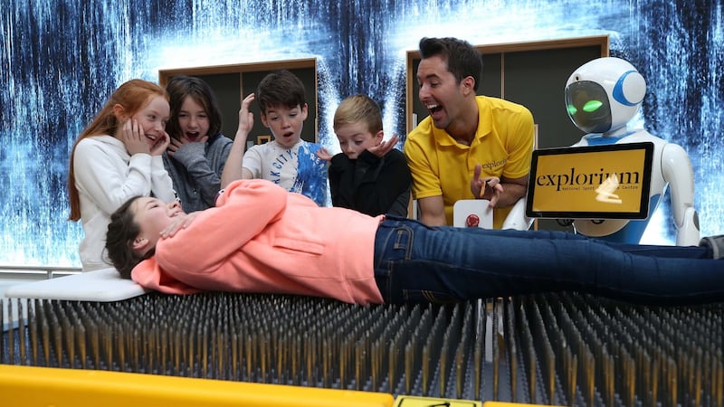 Lying comfortably on a bed of 3000 nails at Explorium in Dublin