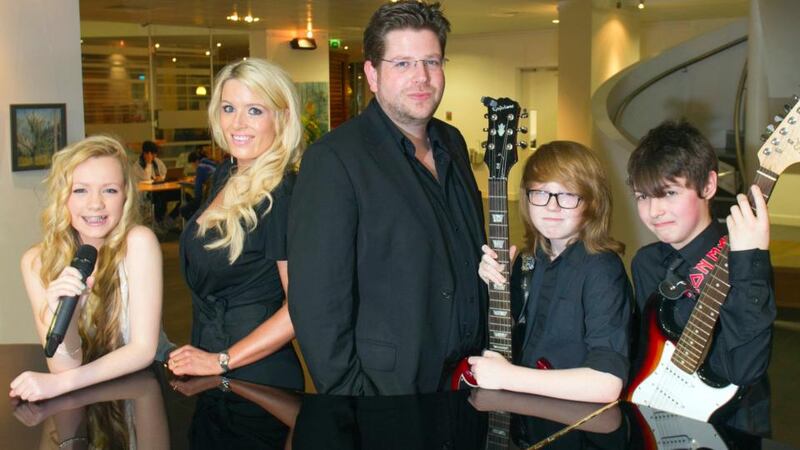 Musical directors Trish and Karl Rooney with Members of the Academy of Popular Music Junior Band in the Cork School of Music: Holly O’Connor, Cian Mullane, Jake O’Driscoll. Photograph:  Michael Mac Sweeney/Provision