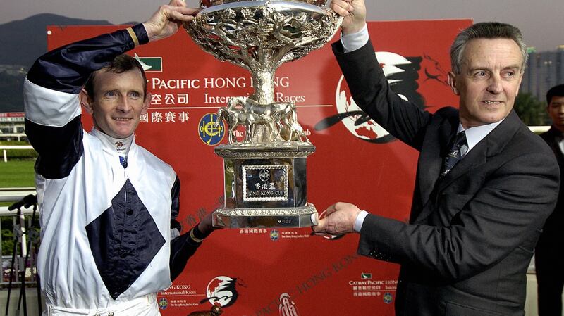 Kevin Manning and Jim Bolger with the trophy after  Alexander Goldrun’s win in the Hong Kong Cup at Sha Tin racetrack in December 2004. Photograph: Philippe Lopez/AFP via Getty Images